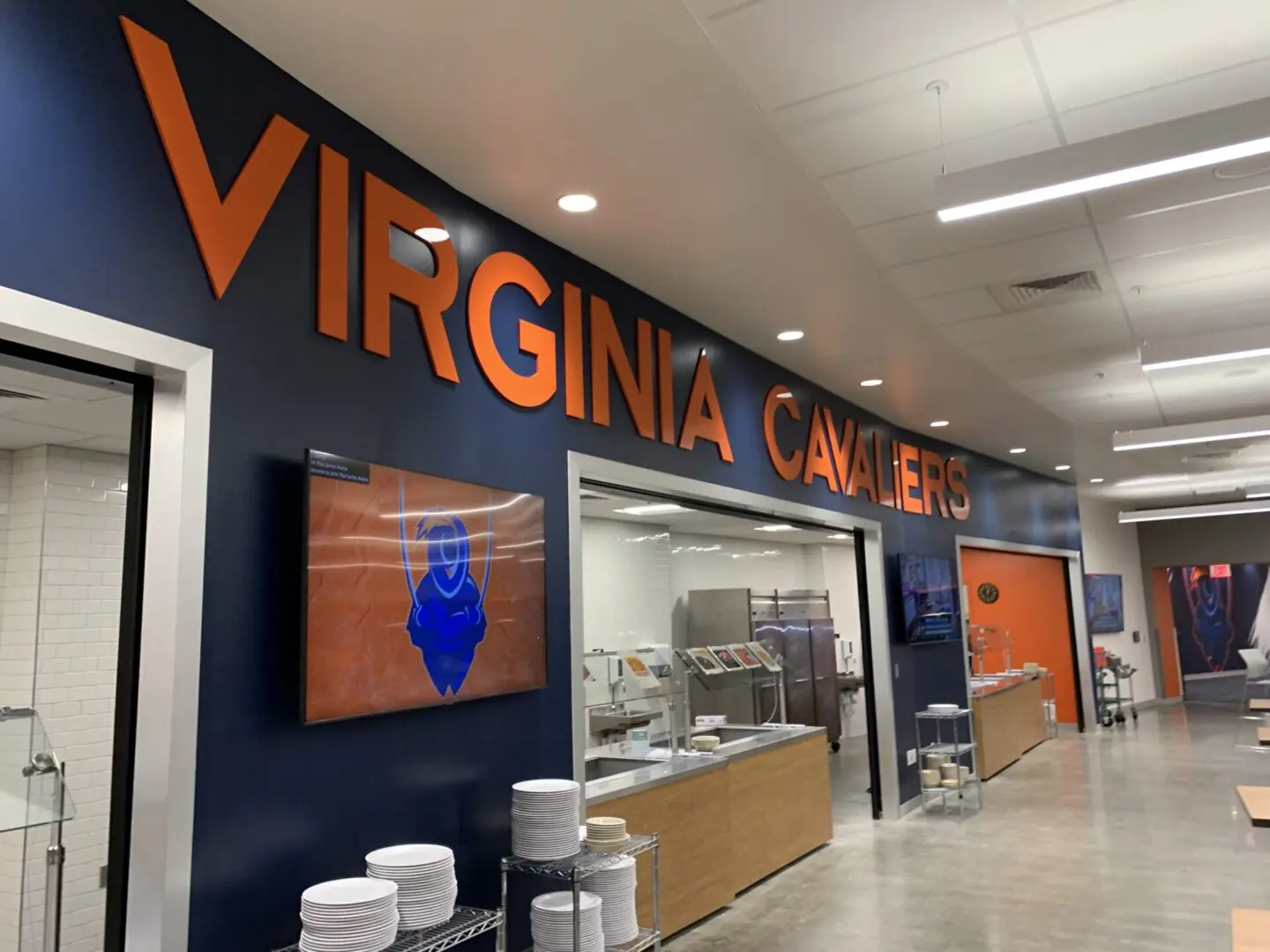A virginia cavaliers sign in the middle of an airport.