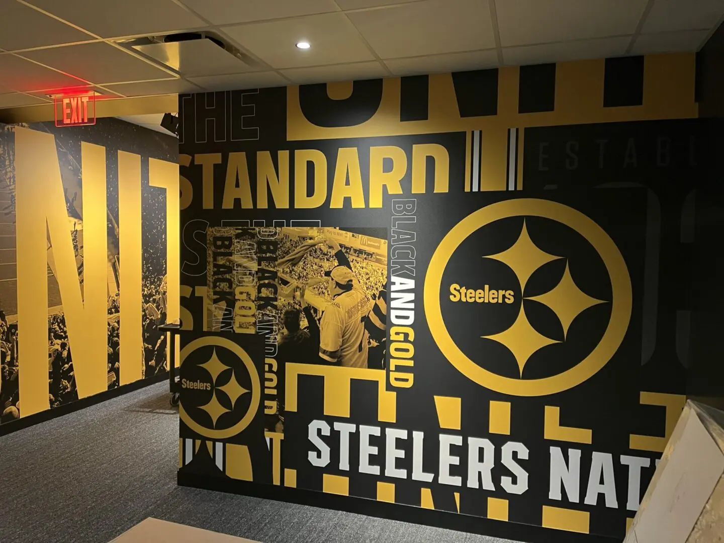 A wall with the steelers logo on it.